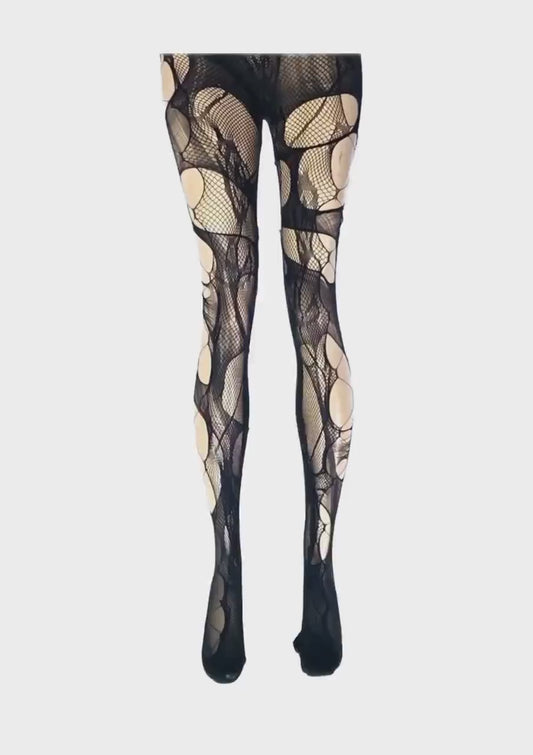Black ripped fishnet tights with corset detail