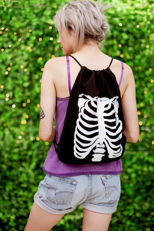 skeleton ribcage print drawstring backpack in black